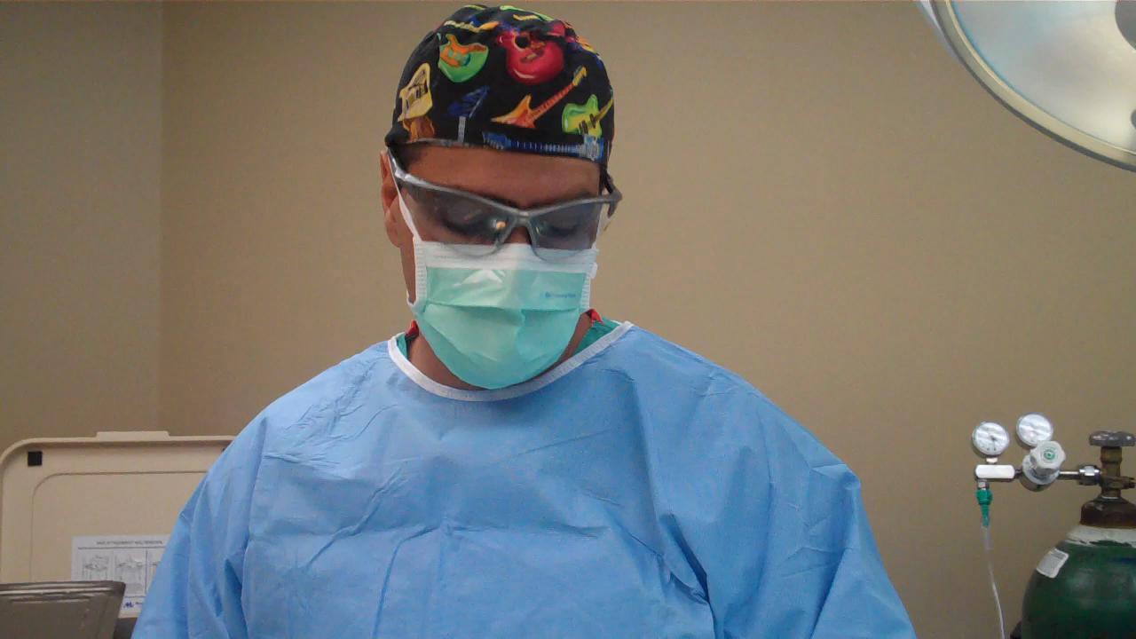 Dr. Robert Tomas in surgery